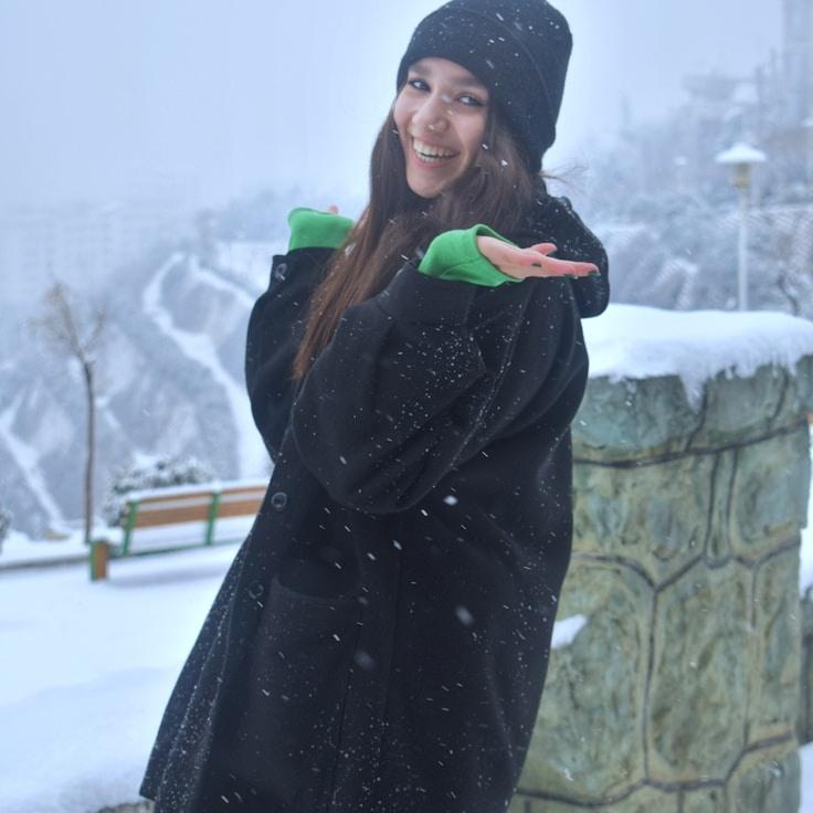 Alex Rivera, Lead Design Curator at Calm Canvas Works, reviewing corporate floral arrangements